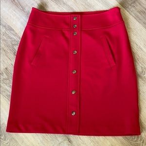 Red mini a/line skirt with silver faux buttons